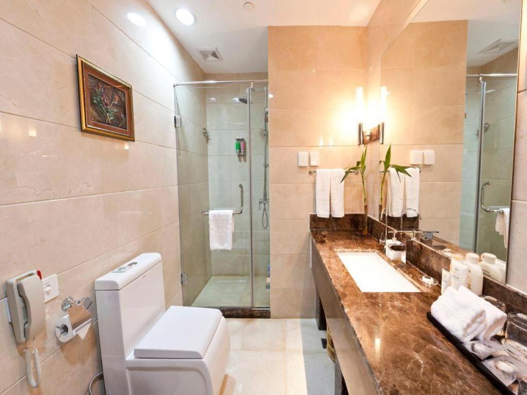 Bliss International Hotel Вэйхай Экстерьер фото