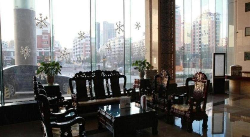 Bliss International Hotel Вэйхай Экстерьер фото