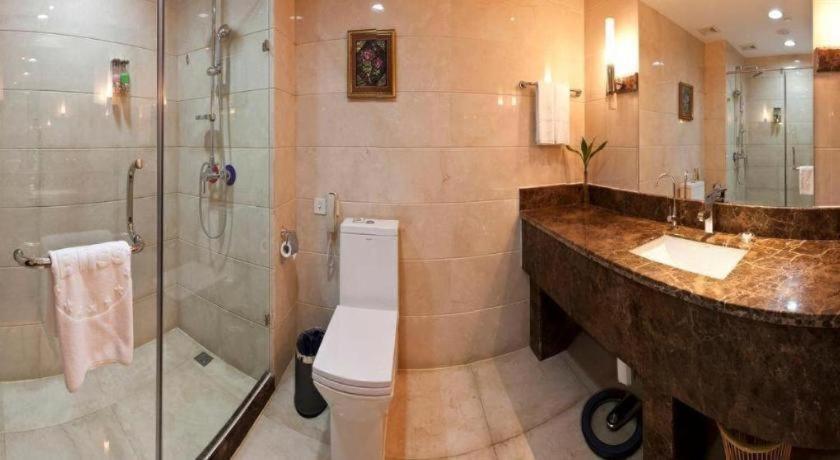 Bliss International Hotel Вэйхай Экстерьер фото