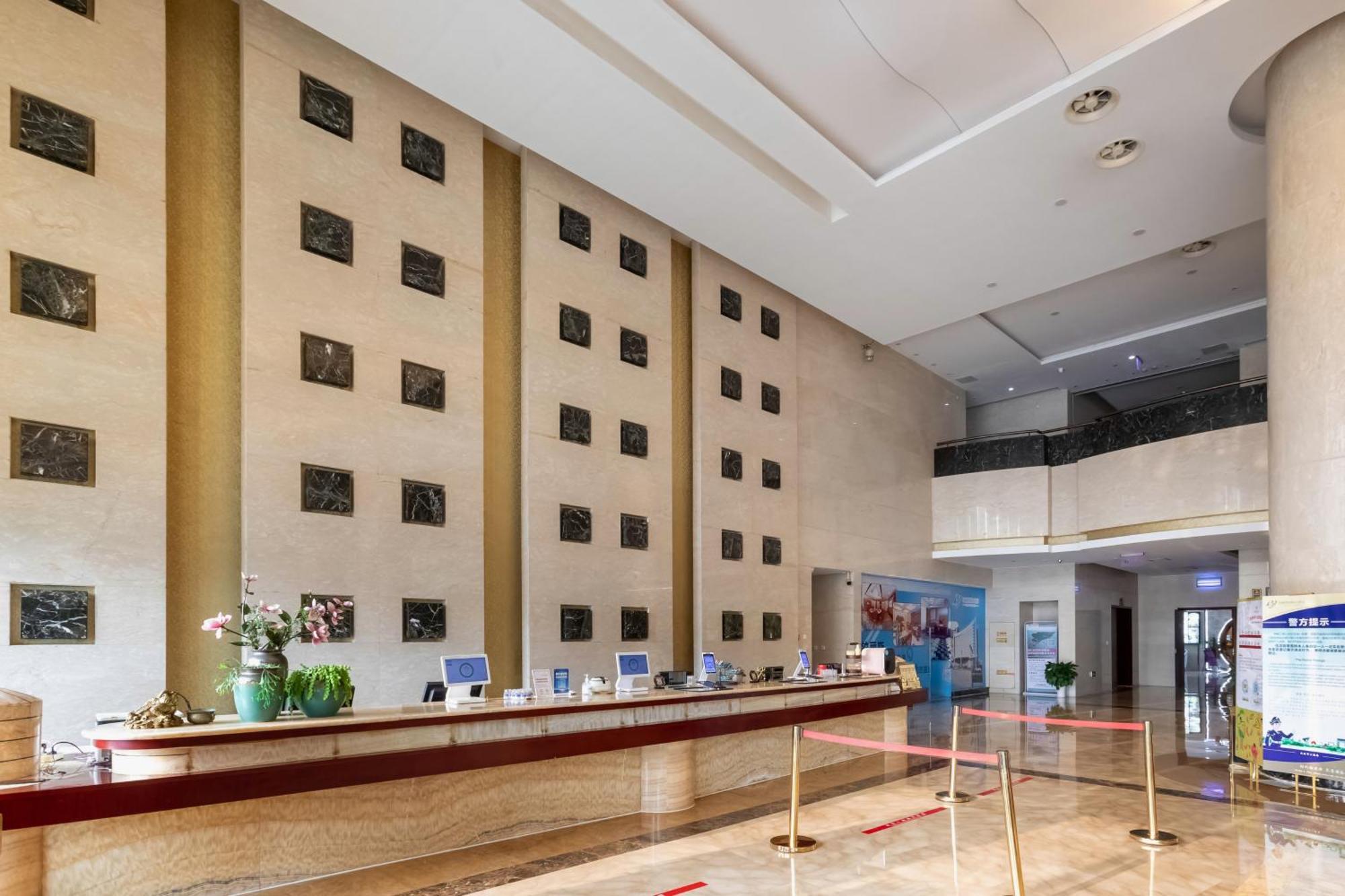 Bliss International Hotel Вэйхай Экстерьер фото