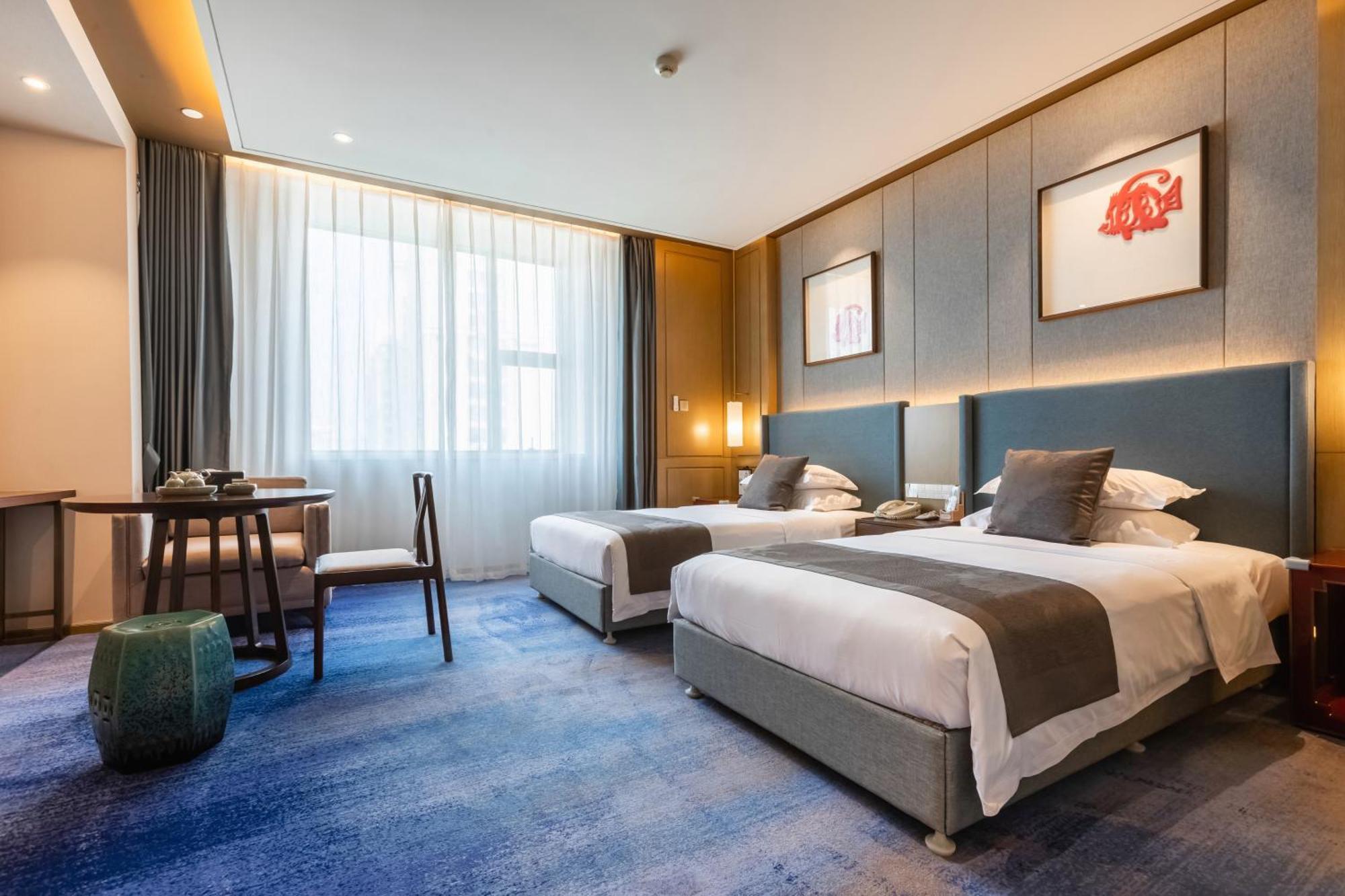 Bliss International Hotel Вэйхай Экстерьер фото
