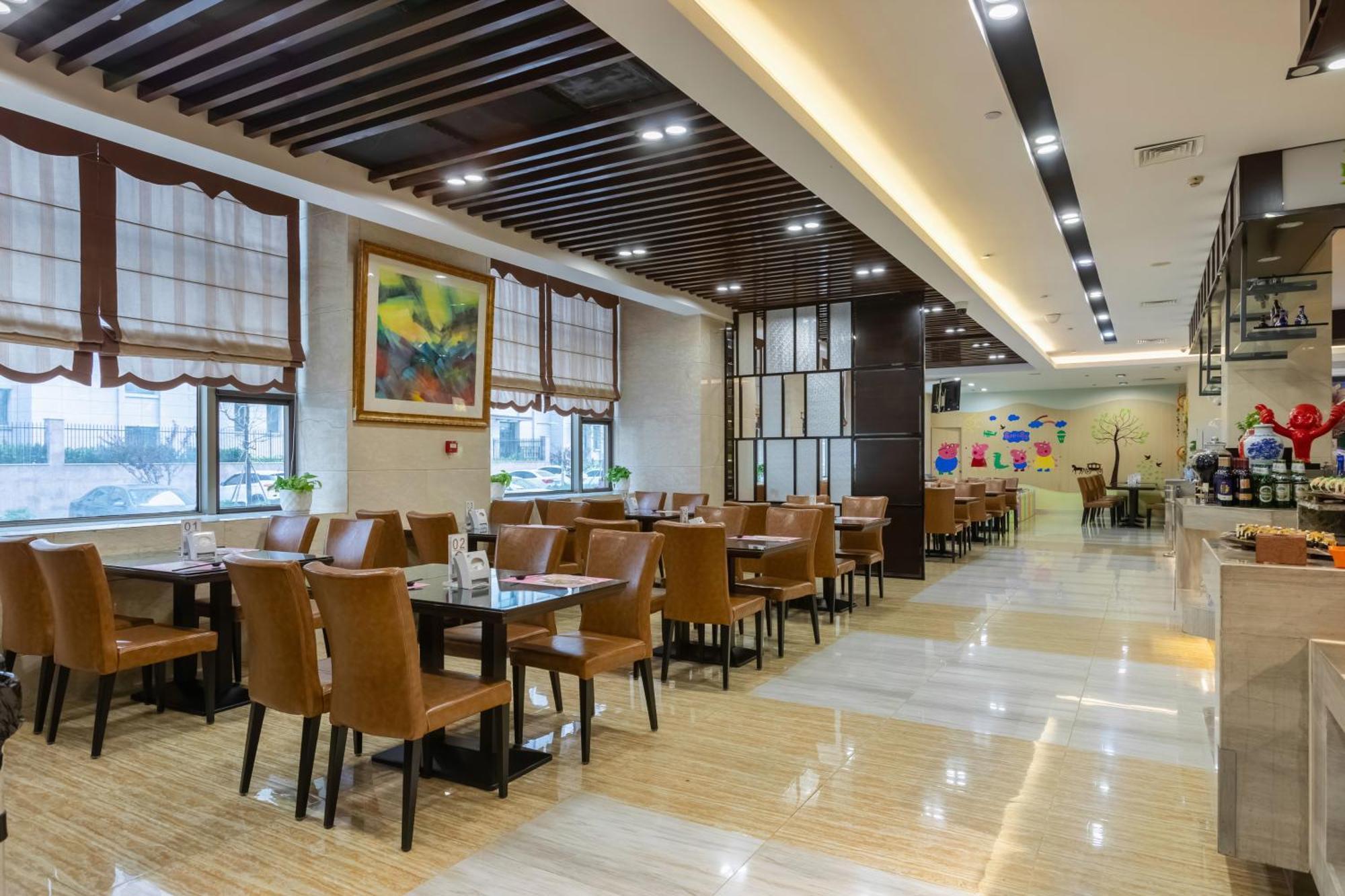 Bliss International Hotel Вэйхай Экстерьер фото
