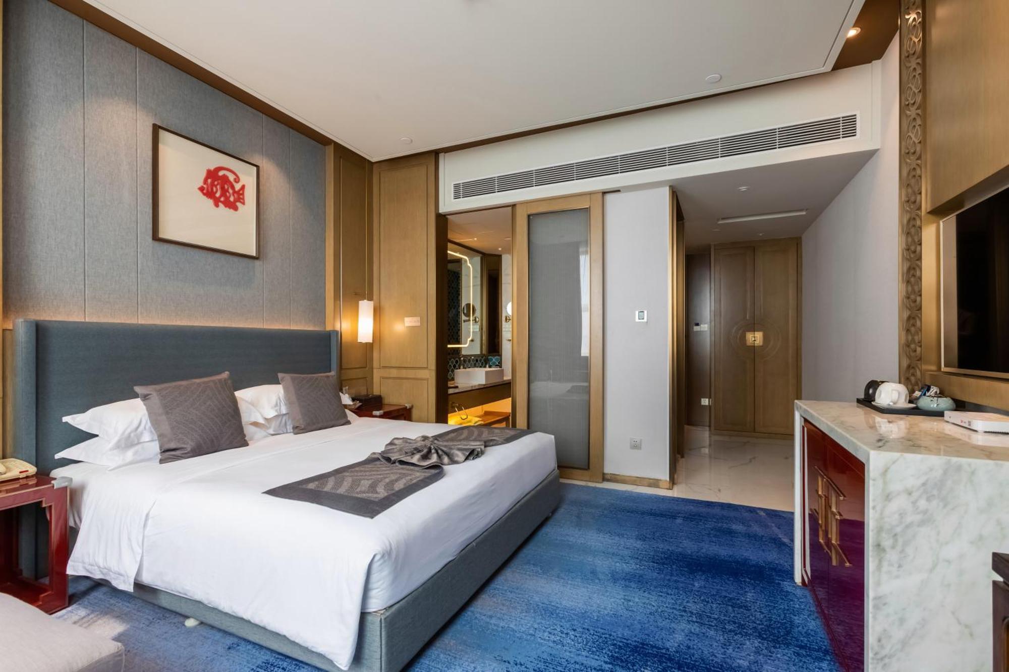 Bliss International Hotel Вэйхай Экстерьер фото