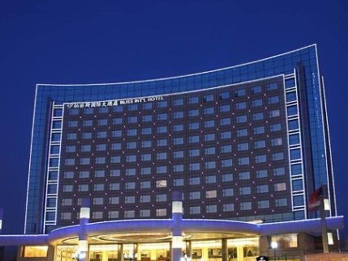 Bliss International Hotel Вэйхай Экстерьер фото